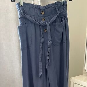 Beautiful blue rayon and linen pants with belt. They are a medium